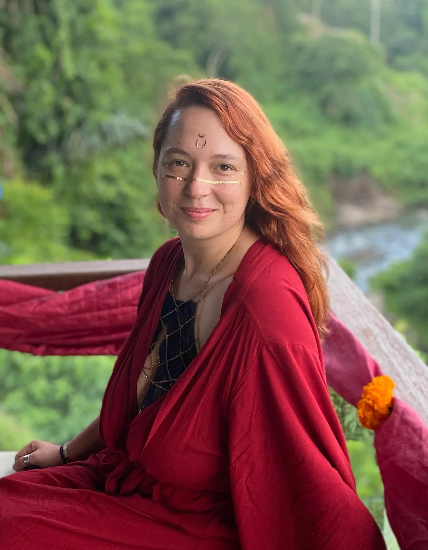 Olga Volshinets outdoors in a red robe